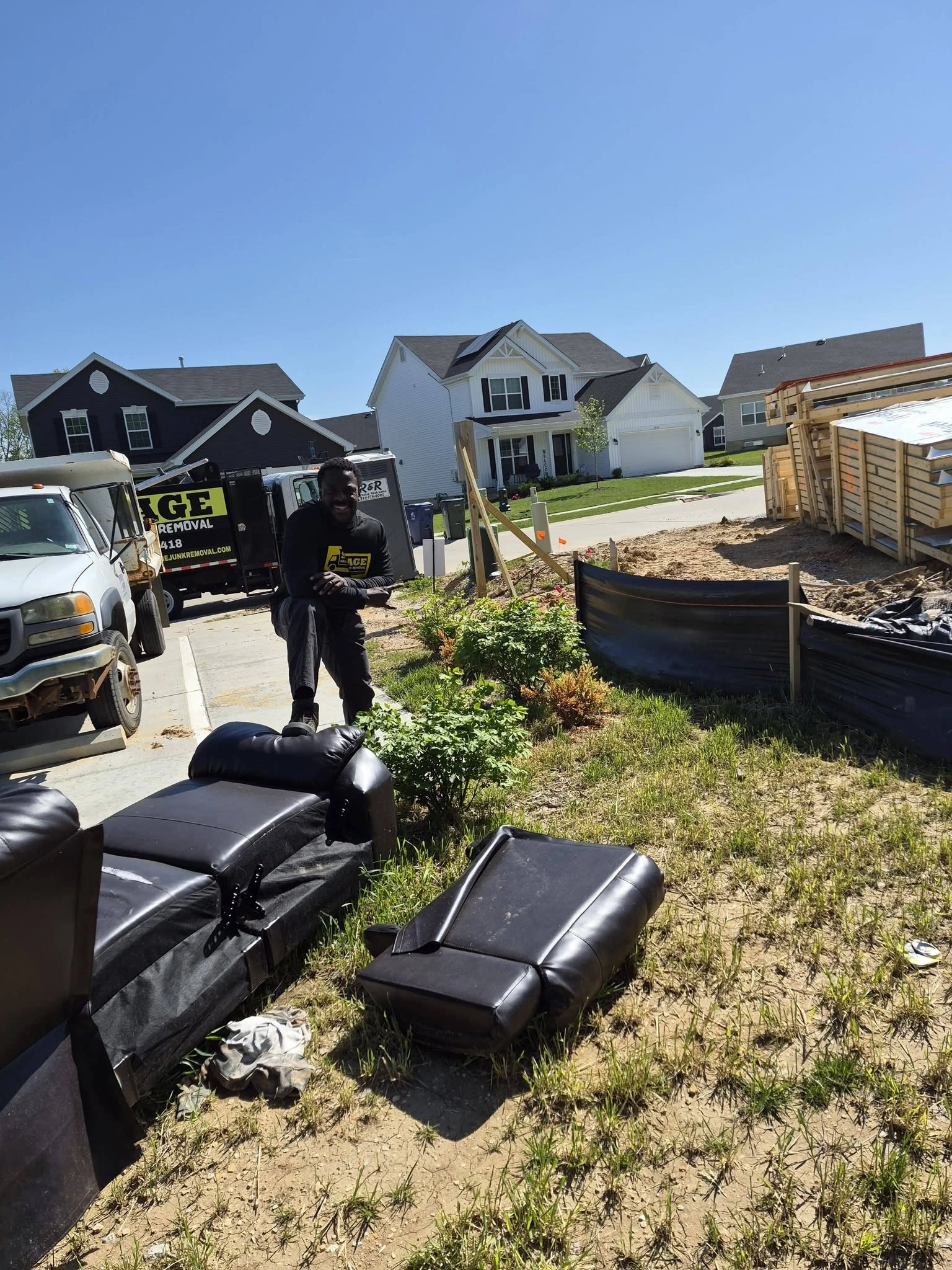 SAVAGE crew hauling away a curbside couch